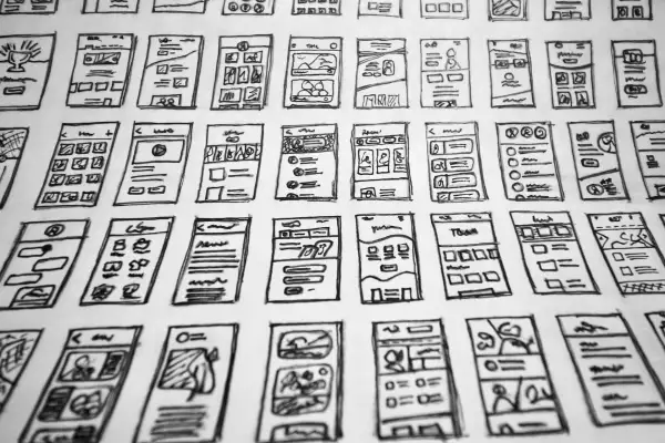 A whole slew of hand-drawn website layouts in black and white.